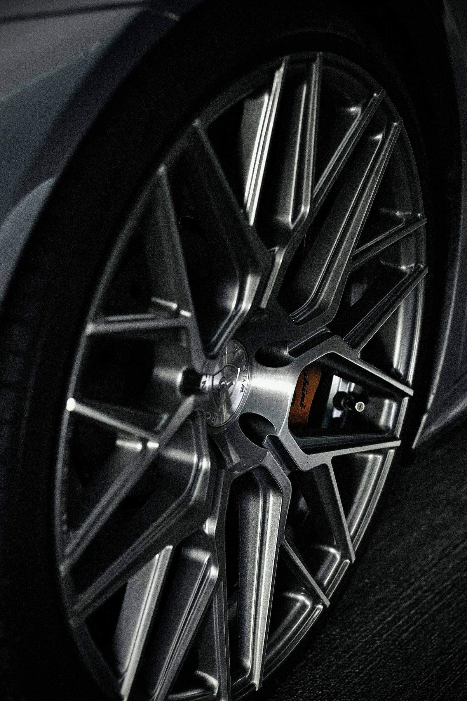 Close-up of a freshly detailed, gleaming alloy wheel